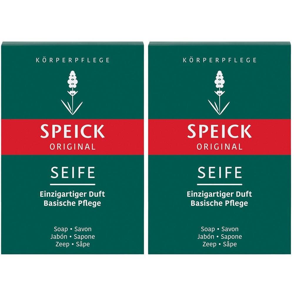 Zwei grüne Seifenverpackungen mit rotem Streifen. Oben steht „Körperpflege“, darunter „SPEICK ORIGINAL SEIFE“. Text: „Einzigartiger Duft, Basische Pflege“.