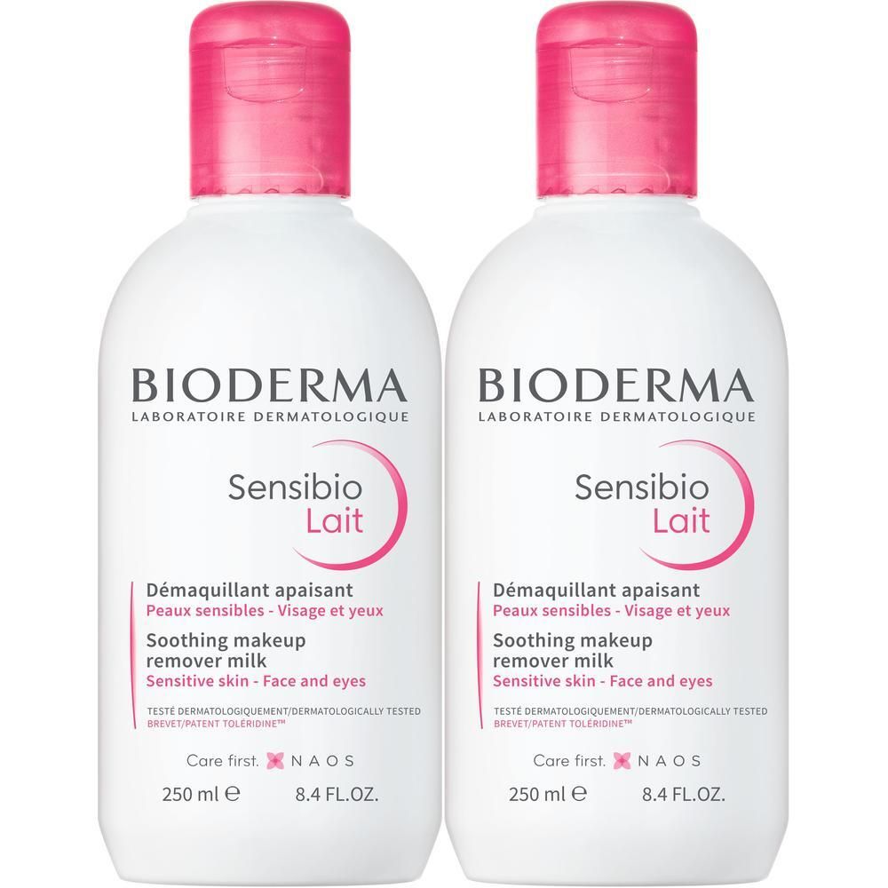 Zwei Flaschen Sensibio Lait Reinigungsmilch. Weiße Flaschen mit rosa Deckel. Aufschrift: BIODERMA, Sensibio Lait.