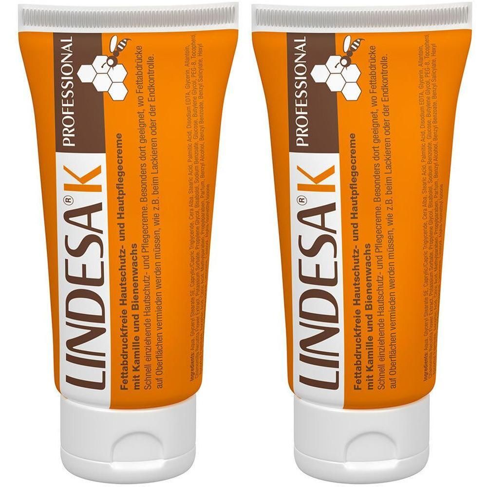 Zwei Tuben LINDESA® K Hautpflegecreme. Orangefarbene Tuben mit weißem Verschluss. Aufschrift: PROFESSIONAL, LINDESA® K, Text.