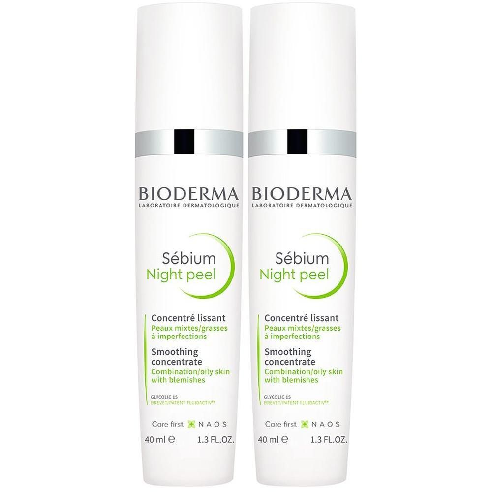 Zwei weiße Flaschen mit silbernen Deckeln. Aufschrift: BIODERMA Sébium Night peel. Text in Grün. 40 ml, 1.3 FL.OZ.