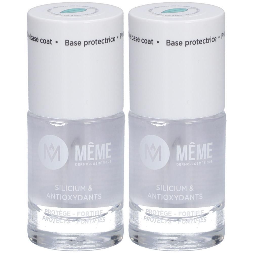 Zwei Flaschen Nagelbase. Klare Flüssigkeit in Glasflaschen mit weißem Deckel. Aufschrift: MÊME, Silicium & Antioxidantien.