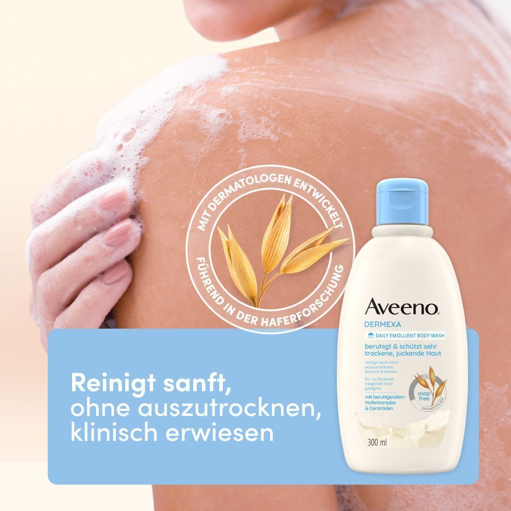 Eine Flasche Aveeno Dermexa Duschcreme. Aufschrift: Dermexa, für trockene Haut. Haferkomplex. Auf dem Arm einer Person wird Schaum gezeigt.