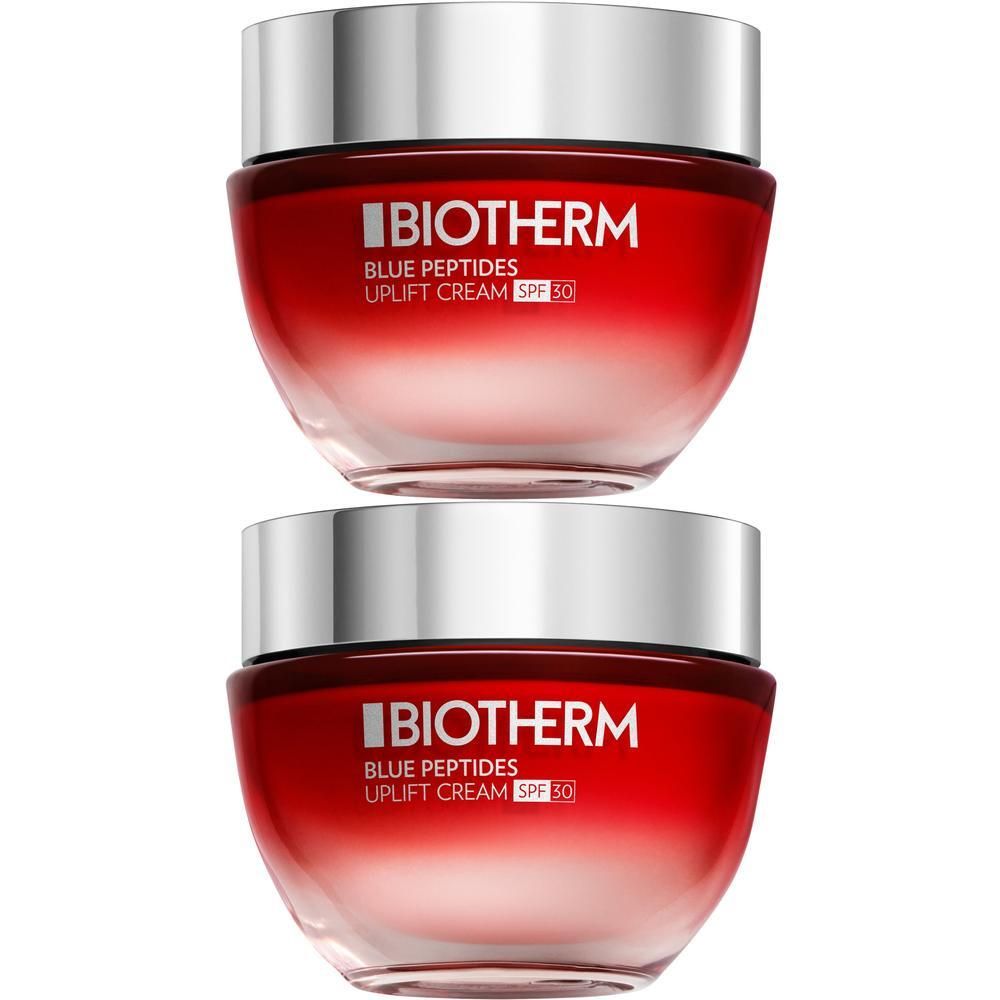 Zwei Tiegel Biotherm Blue Peptides Uplift Cream SPF30. Roter Tiegel mit silbernem Deckel. Aufschrift: BIOTHERM, Blue Peptides, Uplift Cream SPF30.