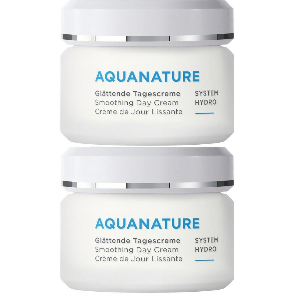 Zwei weiße Tiegel mit ANNEMARIE BÖRLIND AQUANATURE Glättender Tagescreme.
