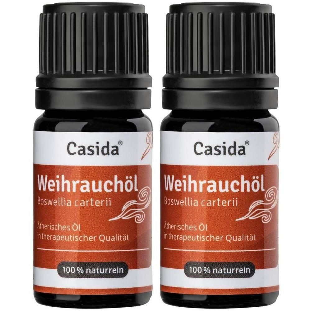 Zwei Flaschen Casida® Weihrauchöl. Braune Glasflaschen mit schwarzem Deckel. Etikett mit Produktinformationen.