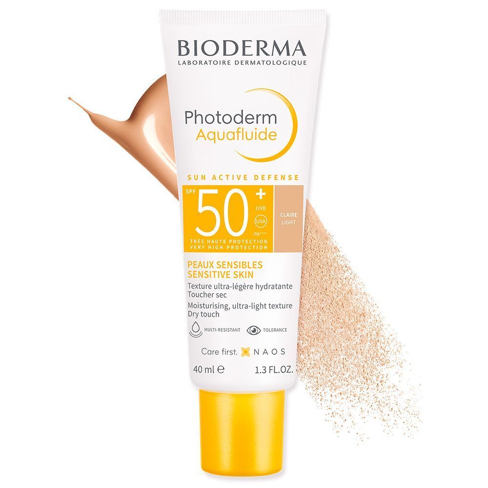 BIODERMA Photoderm Aquafluide LSF 50+ hell getönt. Tube mit Produkt und Farbklecks. Produktname und SPF-Wert deutlich sichtbar.