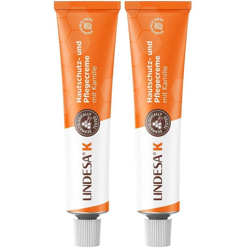 Zwei Tuben Hautschutz- und Pflegecreme. Orangefarbene Tuben mit weißem Verschluss. Aufschrift: LINDESA® K, Hautschutz- und Pflegecreme.