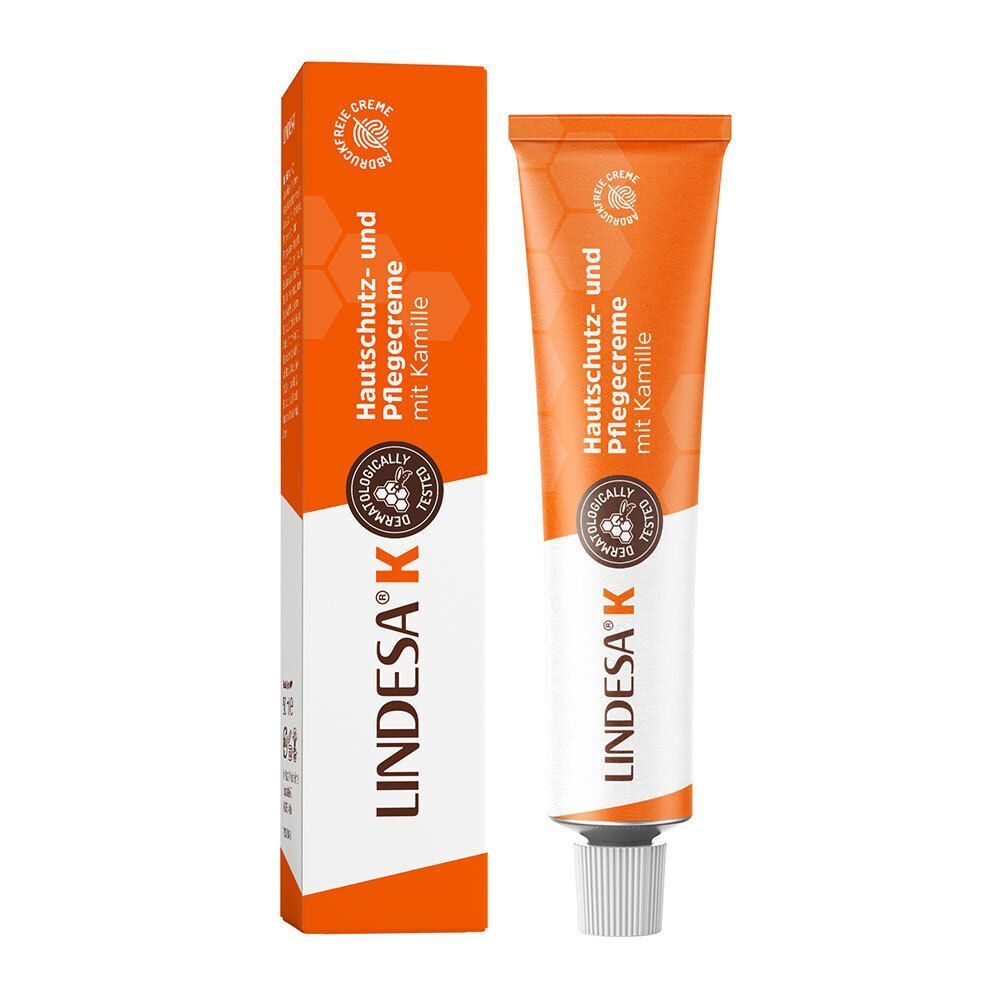 Eine Tube und eine Schachtel Hautschutz- und Pflegecreme. Orangefarbene Tube und Schachtel. Aufschrift: LINDESA® K, Hautschutz- und Pflegecreme.