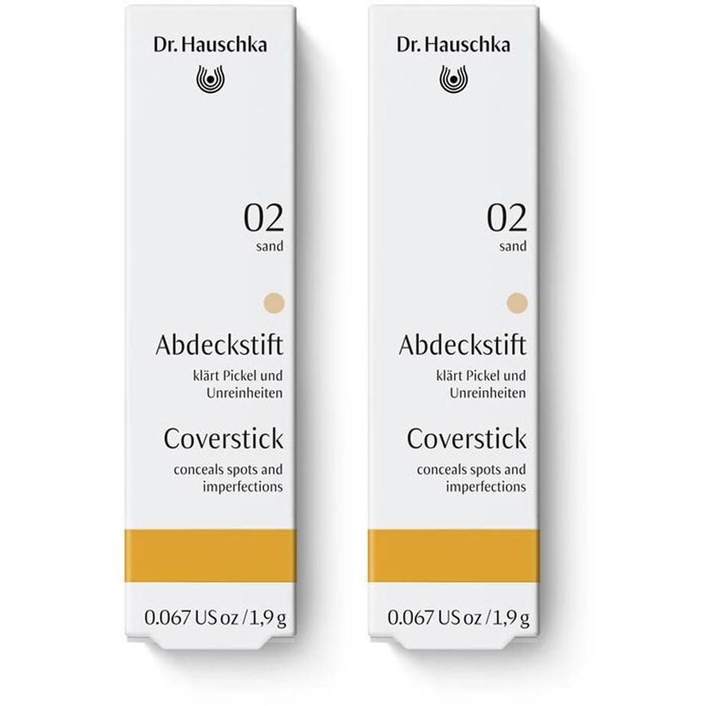 Zwei Dr. Hauschka Abdeckstift 02 sand. Weiße Verpackung mit gelbem Streifen. Produktname und Beschreibung.