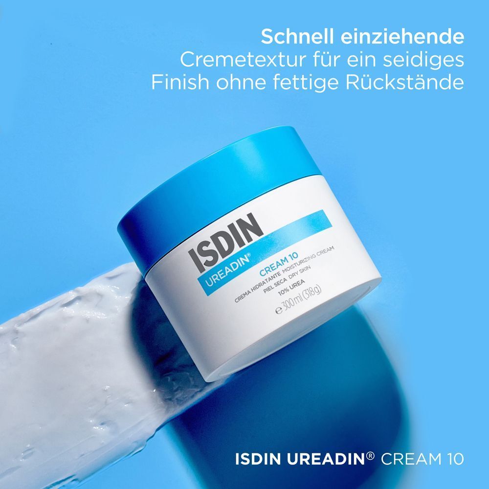 Weißer Cremetiegel mit blauem Deckel. Aufschrift: ISDIN Ureadin Cream 10. Creme auf blauem Hintergrund.