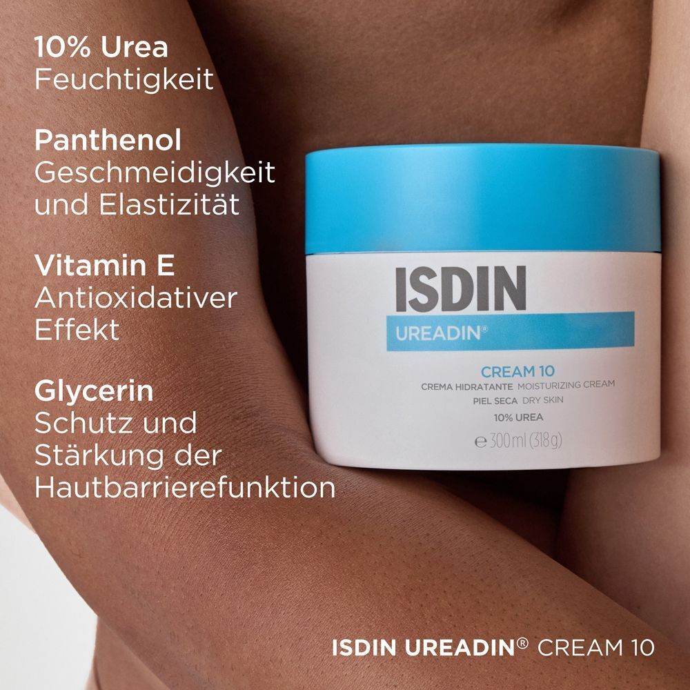 Cremetiegel mit blauem Deckel. Aufschrift: ISDIN Ureadin Cream 10. Inhaltsstoffe: 10% Urea, Panthenol, Vitamin E, Glycerin.