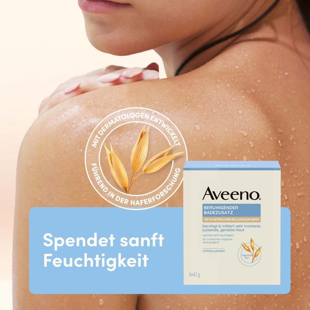 Person zeigt eine Packung Aveeno® Badezusatz. Text: Spendet sanft Feuchtigkeit. Logo und Produktinformationen.