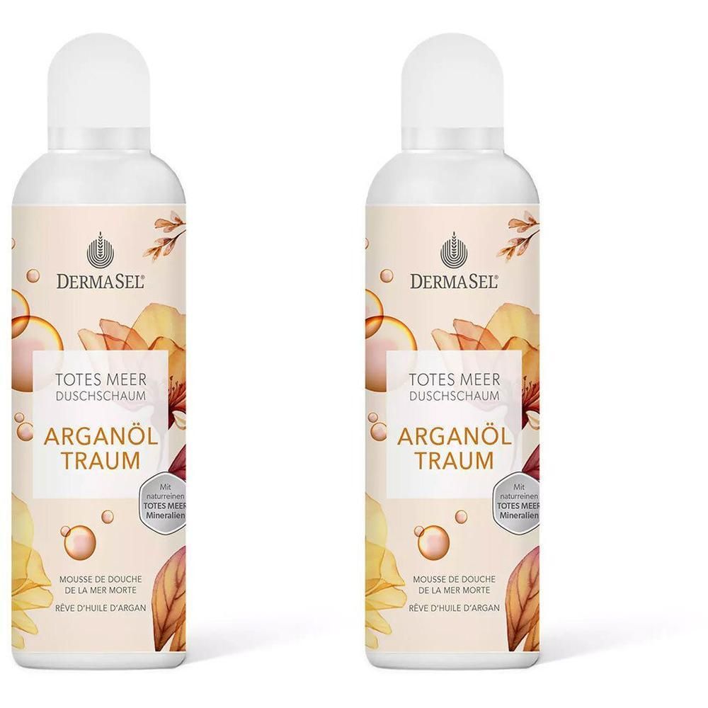 Zwei Flaschen Duschschaum. Aufschrift: DERMASEL, Totes Meer Duschschaum, Arganöl Traum. Mit floralen Illustrationen und weißem Deckel.