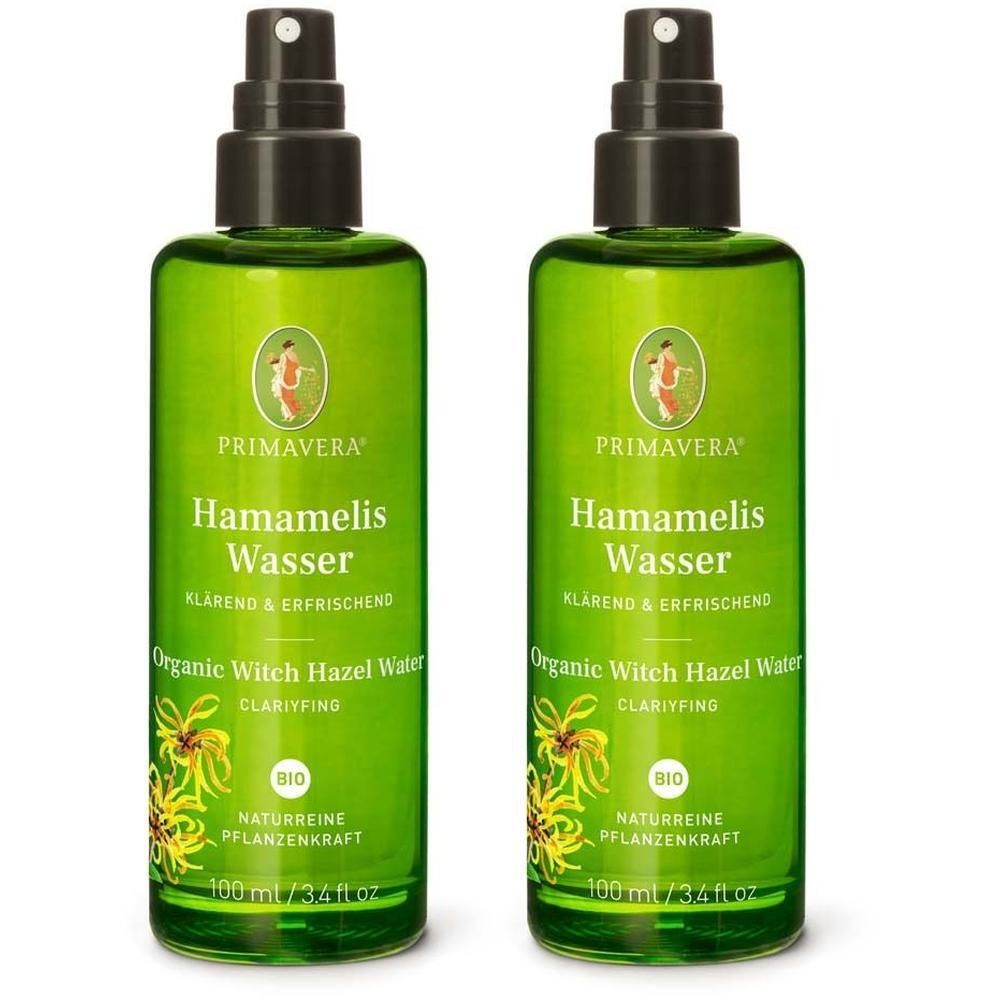 Zwei grüne Sprühflaschen mit schwarzem Sprühkopf. Aufschrift: Hamamelis Wasser, Organic Witch Hazel Water, Bio-Siegel. Marke: PRIMAVERA.