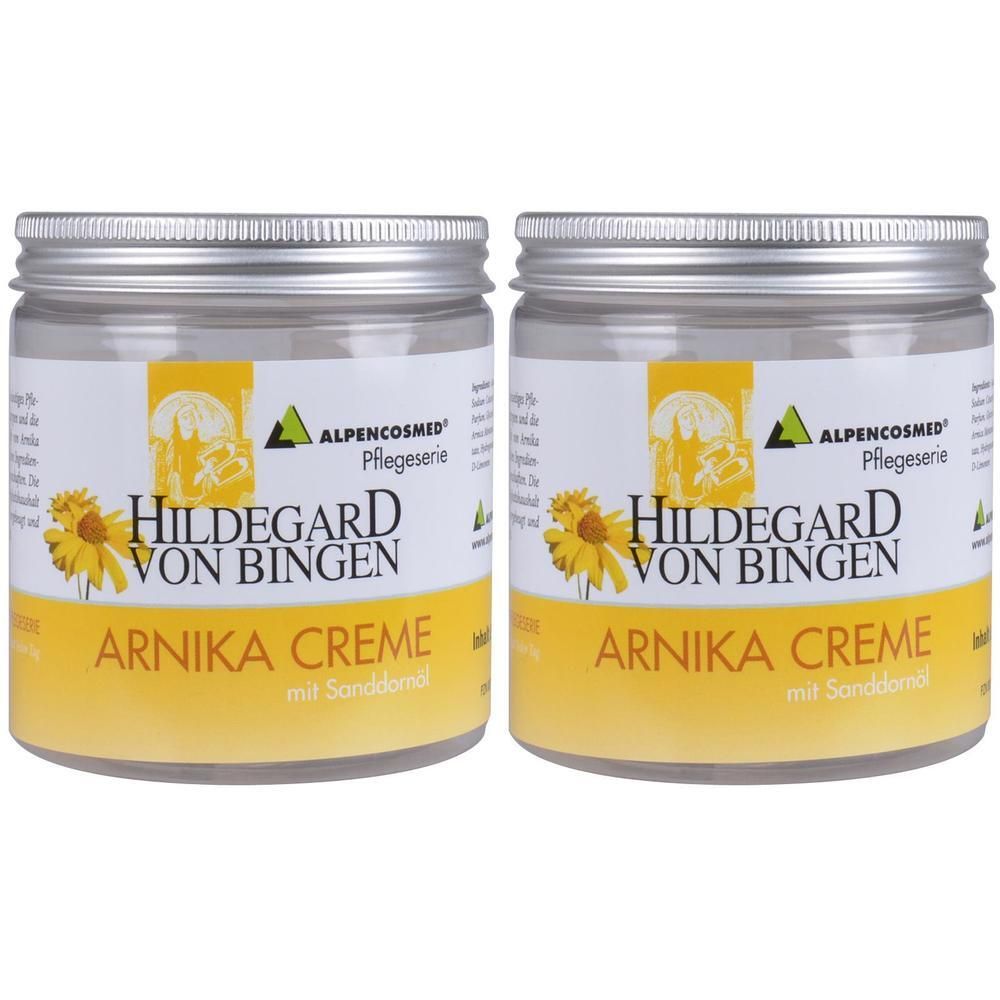Zwei Gläser Creme mit Schraubverschluss. Auf den Etiketten steht: Hildegard von Bingen Arnika Creme. Gelb-weißes Design mit Sonnenblumen-Illustration.
