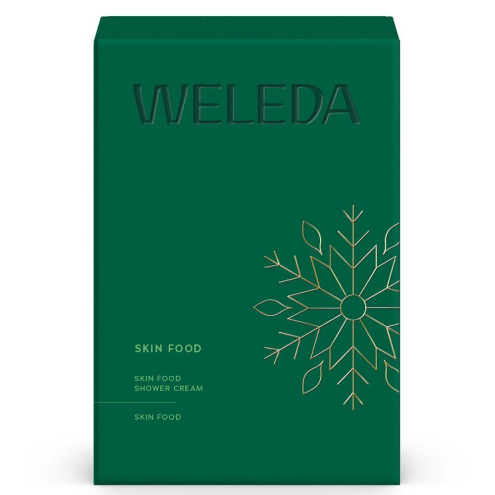 Grüne Geschenkbox mit goldener Schneeflocke. Aufschrift: Weleda, Skin Food, Skin Food Shower Cream.