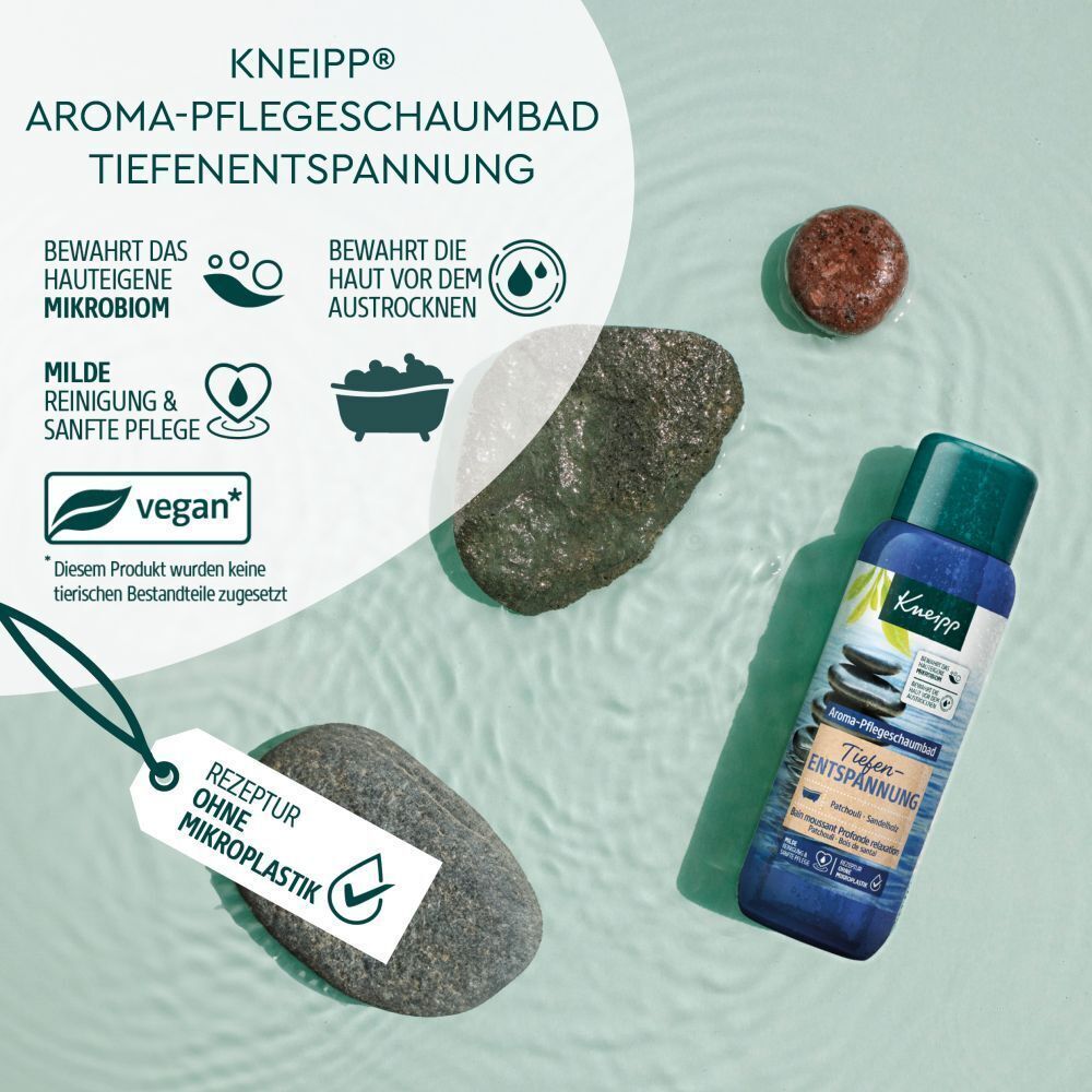 Kneipp Aroma-Pflegeschaumbad Tiefenentspannung, Steine, Label mit 'Rezeptur ohne Mikroplastik', vegan-Siegel.