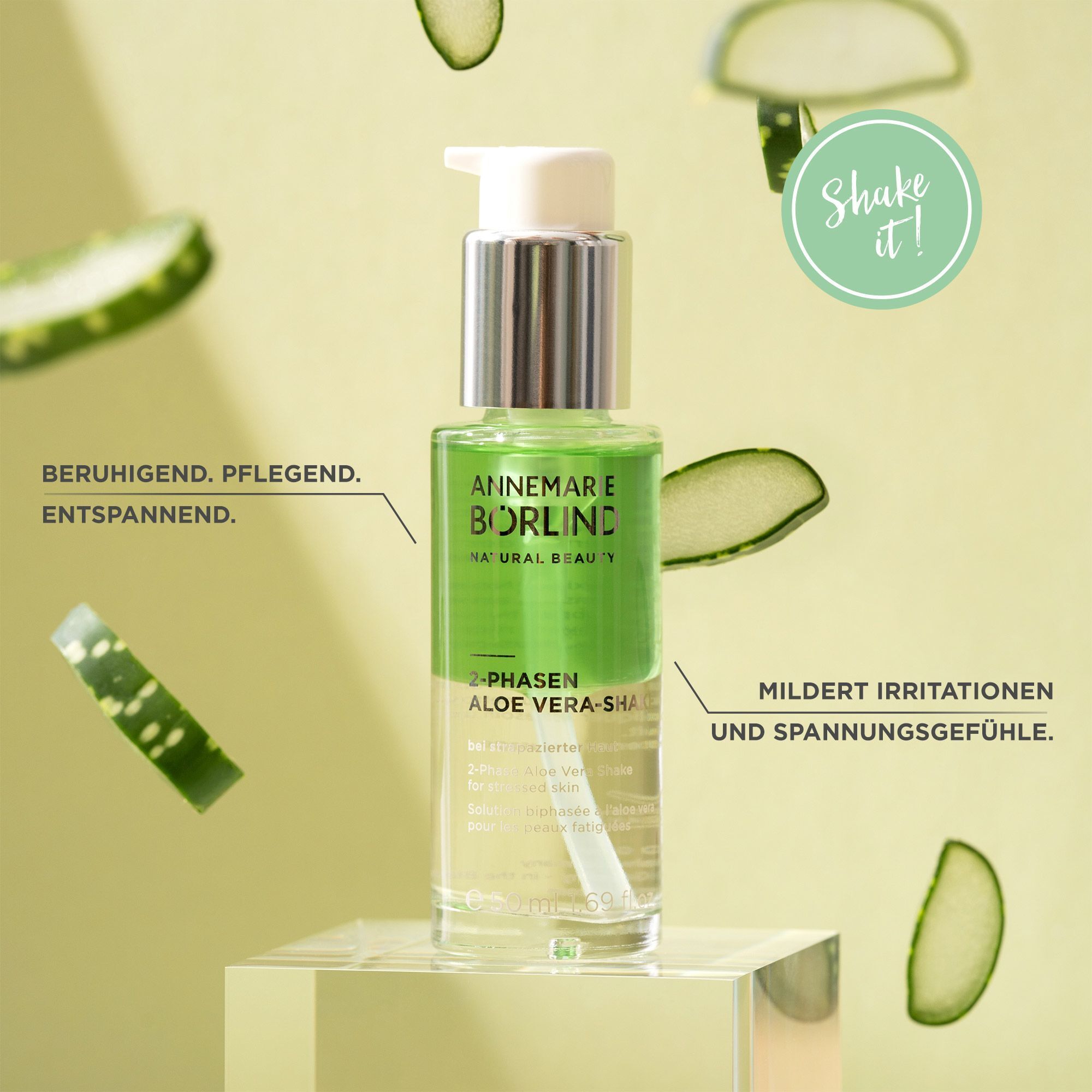 Pumpflasche ANNEMARIE BÖRLIND 2-PHASEN ALOE VERA-SHAKE mit Aloe-Vera-Scheiben und Text.