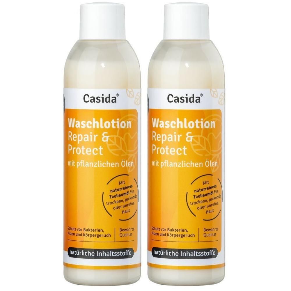 Zwei Flaschen Casida Waschlotion Repair & Protect. Weiße Flaschen mit gelben Etiketten. Text: Waschlotion, Repair & Protect.