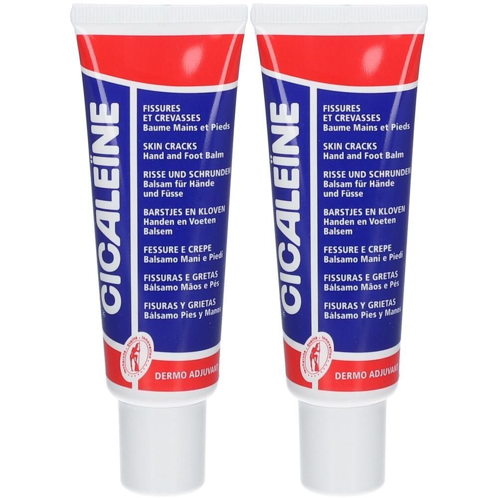 Zwei Tuben CICALEINE Balsam. Weißer Deckel, roter und blauer Tubenkörper mit Produktinformationen und Logo. Aufschrift: Fissuren, Hautrisse.