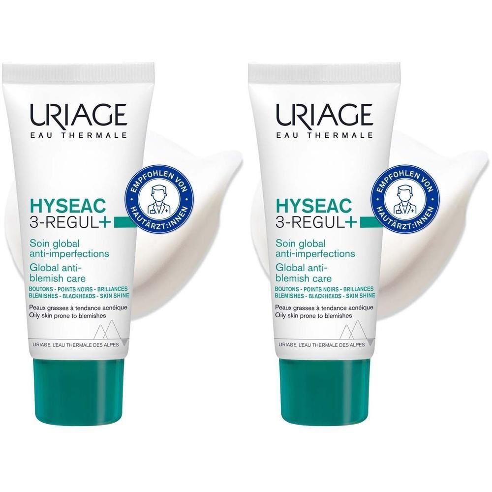 Zwei Tuben URIAGE Hyseac 3-Regul+ Creme. Weiß, mit grünen Verschlüssen. Text: Hyseac 3-Regul+, empfohlen von Hautärzten.