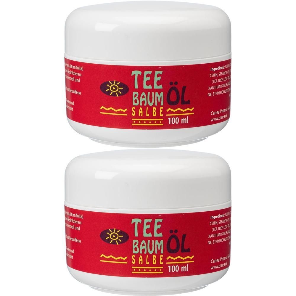 Zwei weiße Tiegel mit rotem Etikett. Aufschrift: TEEBAUM ÖL SALBE. 100 ml.