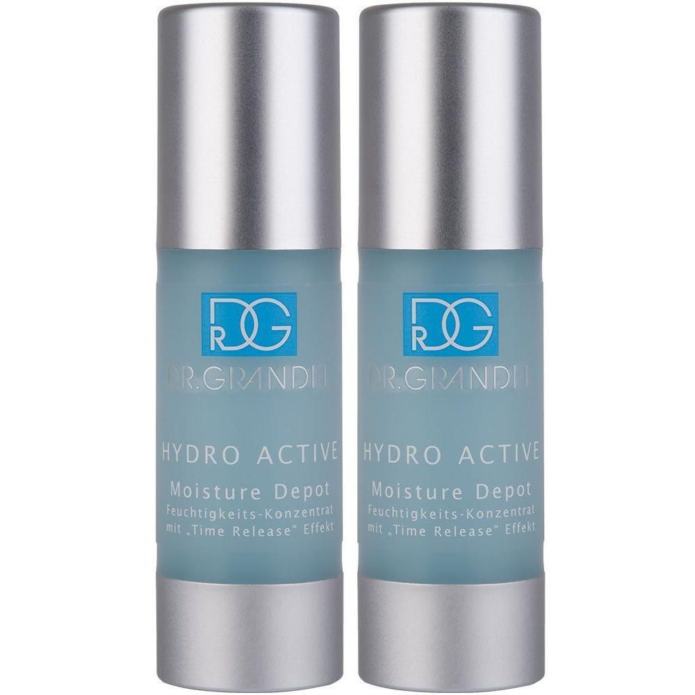 Zwei Flakons Dr. Grandel Hydro Active Moisture Depot. Zylinderförmige Flaschen mit silbernem Deckel und blauer Flüssigkeit.