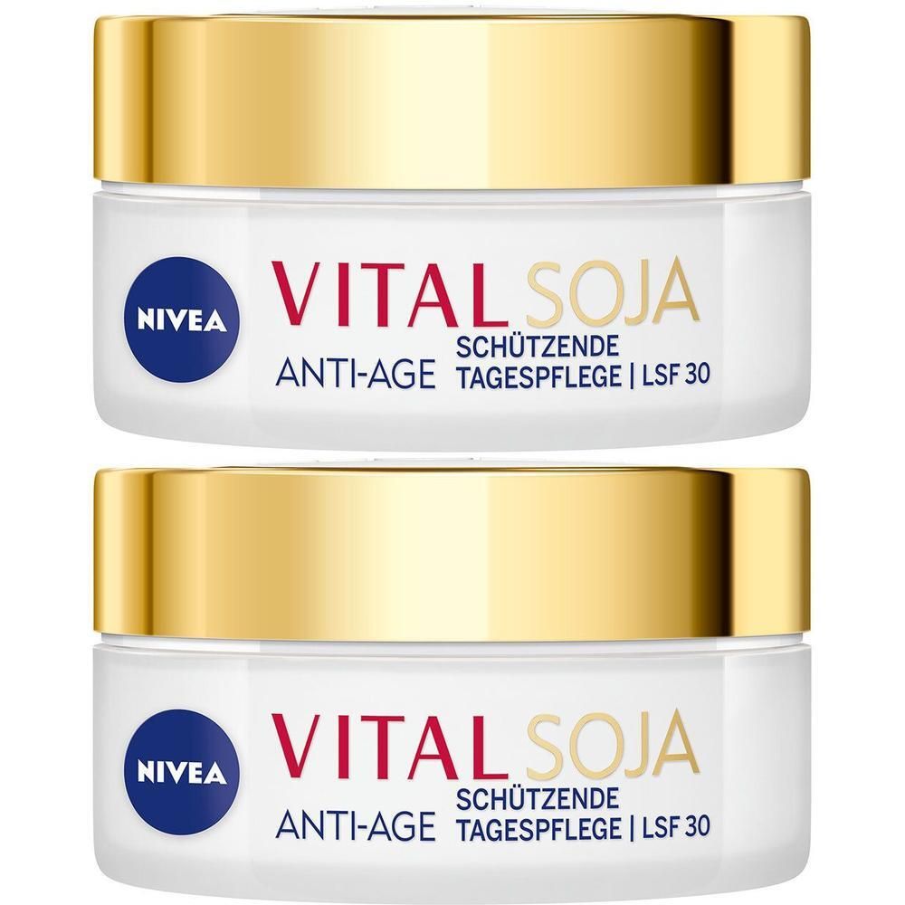 Zwei Tiegel NIVEA VITAL Soja Anti-Age Tagespflege LSF 30. Weiße Tiegel mit goldenen Deckeln. Aufschrift: VITAL SOJA, ANTI-AGE, SCHÜTZENDE TAGESPFLEGE LSF 30.