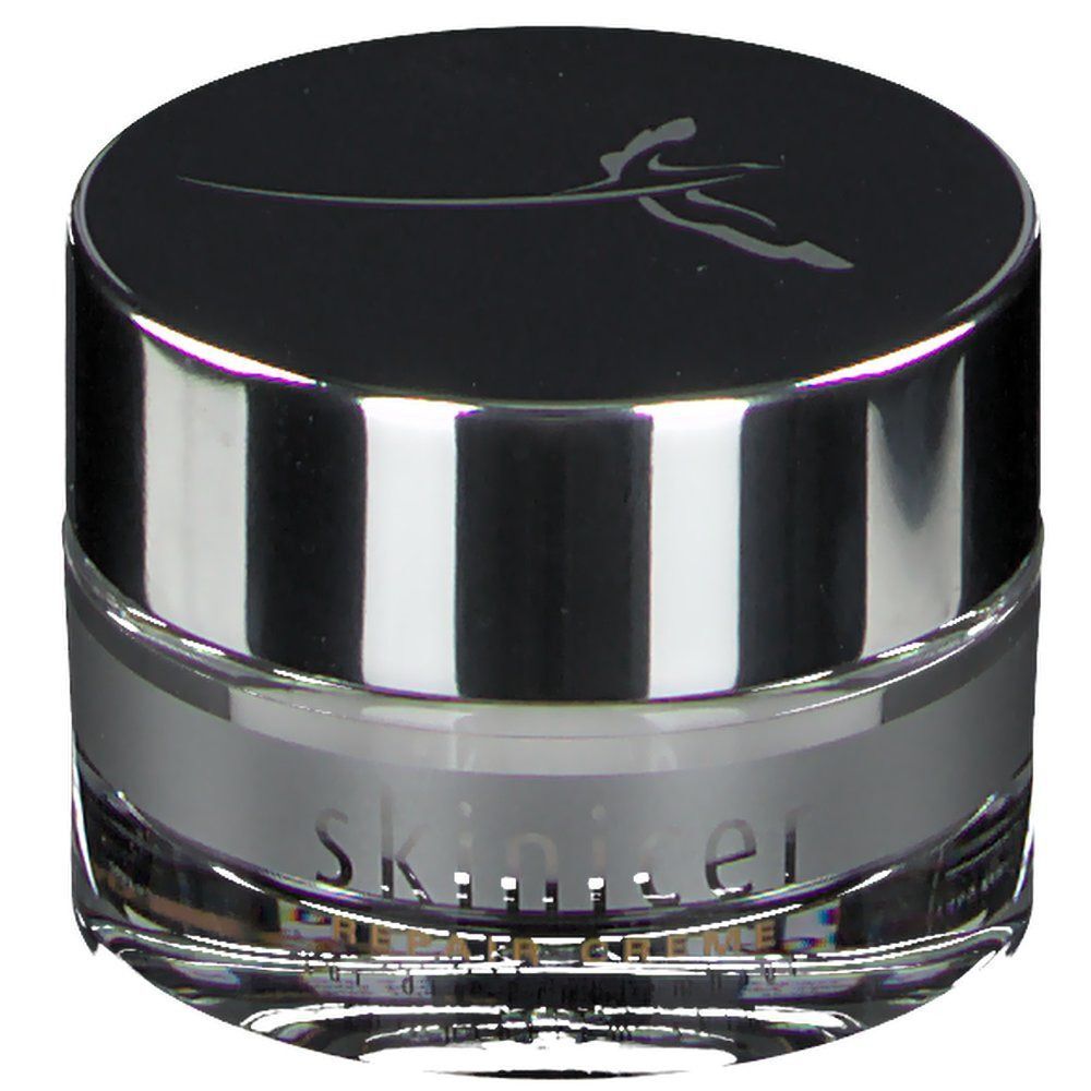 Cremetiegel mit silberfarbenem Rand und Deckel. Auf dem Deckel ein Logo. Schriftzug skinicer® Repair Creme.
