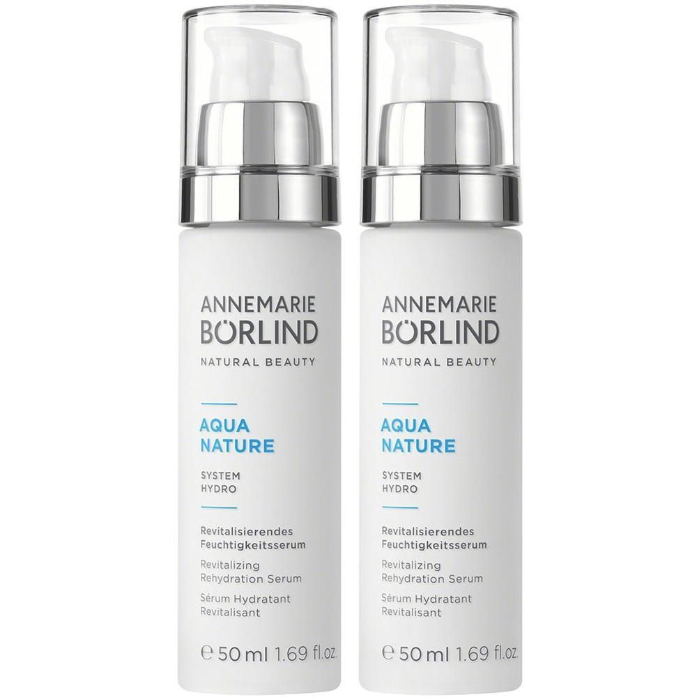 Zwei weiße Pumpspender mit silbernem Ring und klarem Deckel. Beschriftung: ANNEMARIE BÖRLIND AQUA NATURE SYSTEM HYDRO.