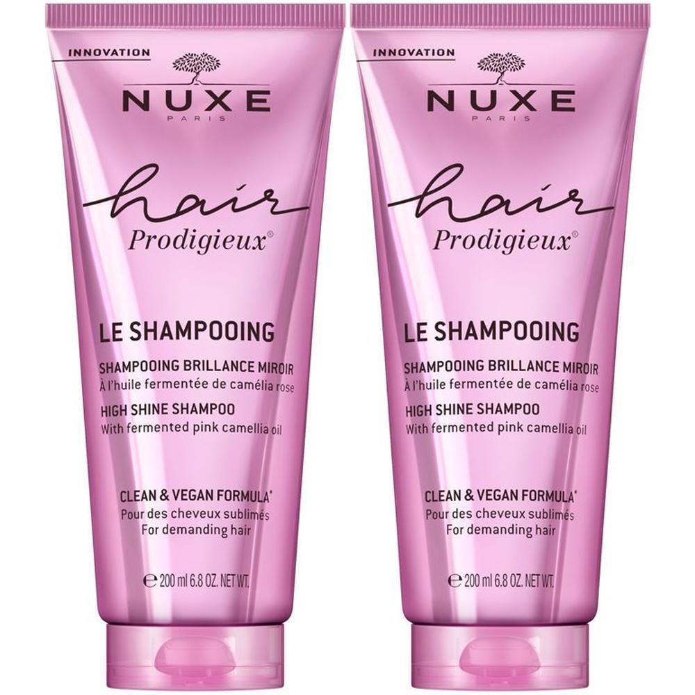 Zwei rosa Shampoo-Tuben. Aufschrift: NUXE, hair Prodigieux, Le Shampooing, High Shine Shampoo. Clean & Vegan Formula.
