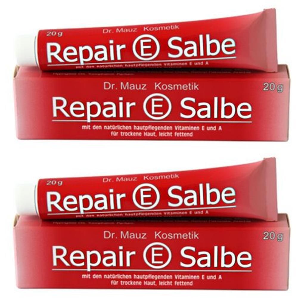 Zwei Tuben und zwei Schachteln Repair E Salbe. Rote Verpackung mit weißer Schrift. Aufschrift: Dr. Mauz Kosmetik, 20g.
