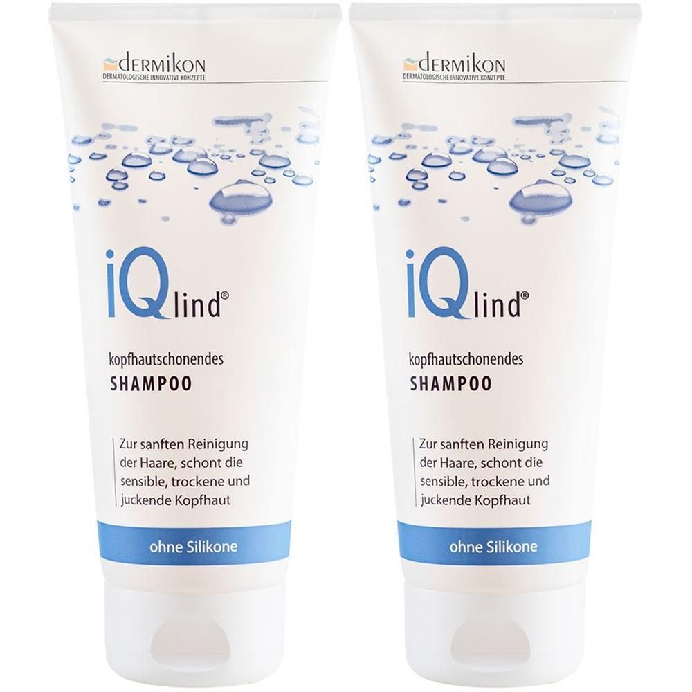 Zwei weiße Tuben Shampoo mit blauen Akzenten. Aufschrift: iQlind, kopfhautschonendes Shampoo. Ohne Silikone. Marke: dermikon.