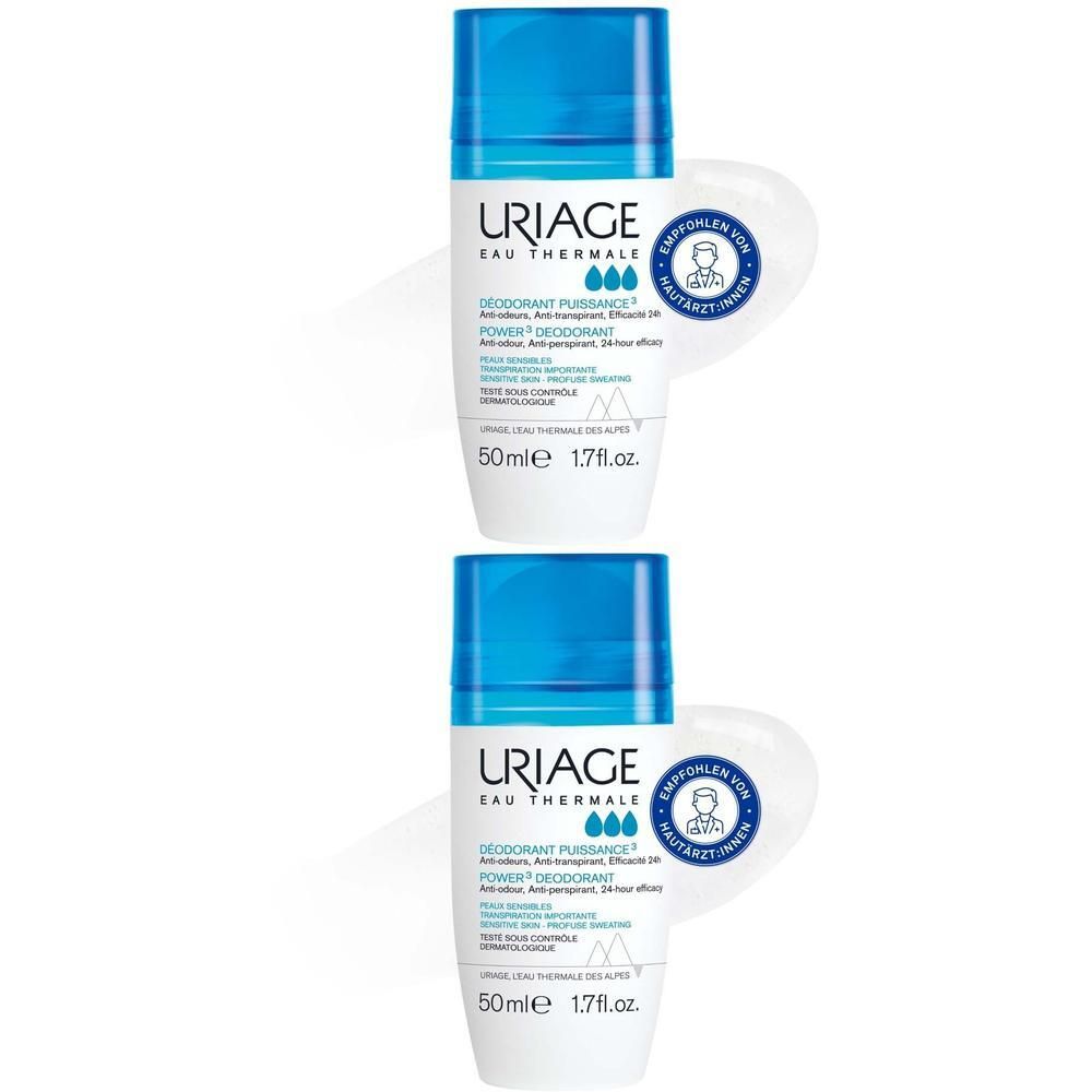 Zwei Roll-on-Deodorants. Blau-weiße Flaschen mit blauen Kappen. URIAGE-Logo und Produktbezeichnung. Empfohlen von Hautärzten.