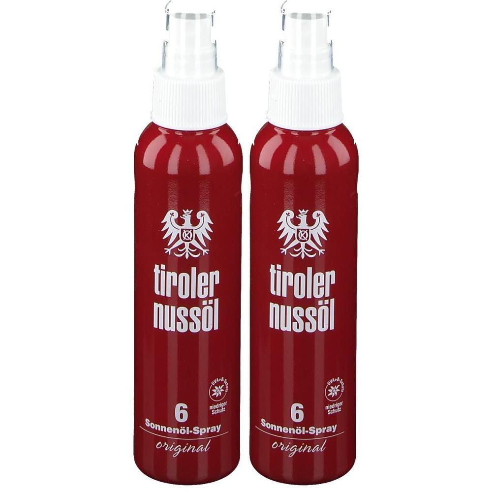 Zwei rote Sprühflaschen mit weißem Deckel. Aufschrift: Tiroler Nussöl, Sonnenöl-Spray 6, original. Logo mit Adler.