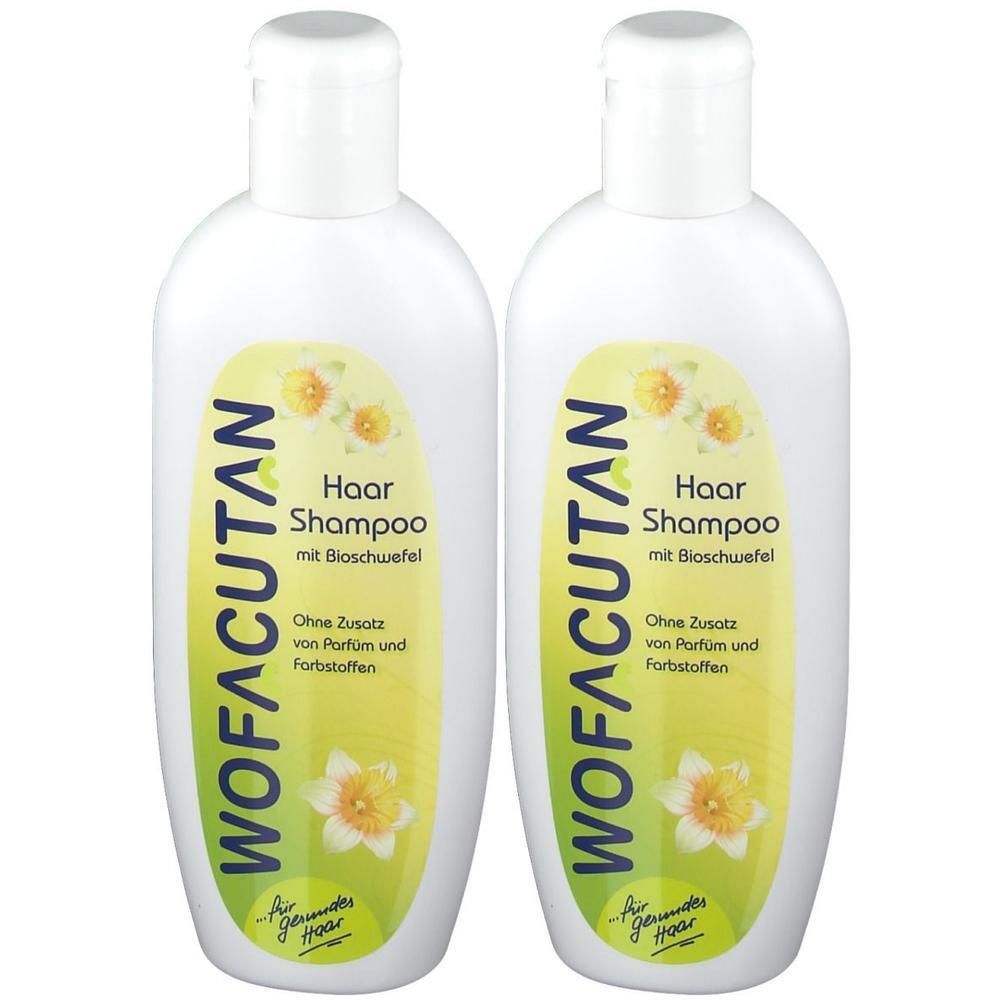 Zwei weiße Flaschen WOFACUTAN Haarshampoo. Auf jeder Flasche steht „Haar Shampoo mit Bioschwefel“. Gelb-grünes Etikett mit Blumen.