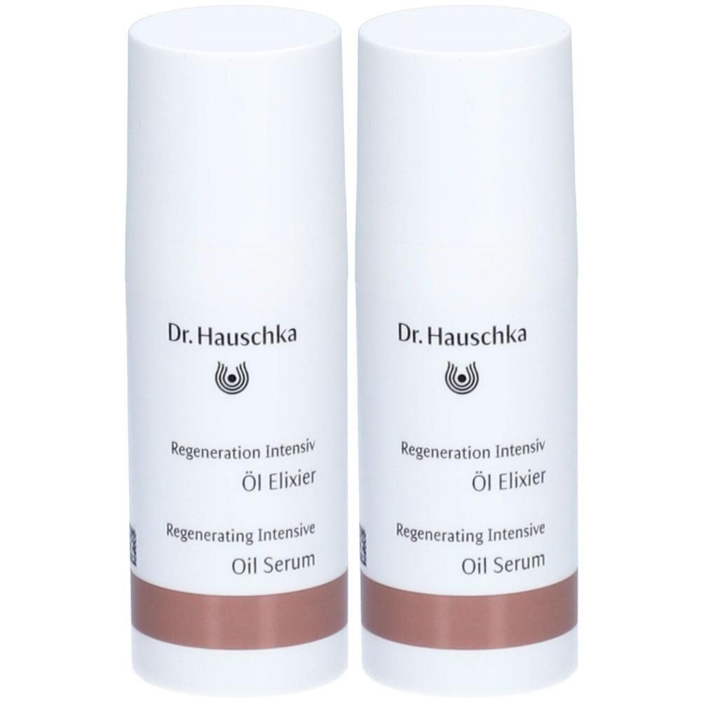 Zwei weiße Flaschen mit braunem Boden. Aufschrift: Dr. Hauschka, Regeneration Intensiv Öl Elixier, Regenerating Intensive Oil Serum.