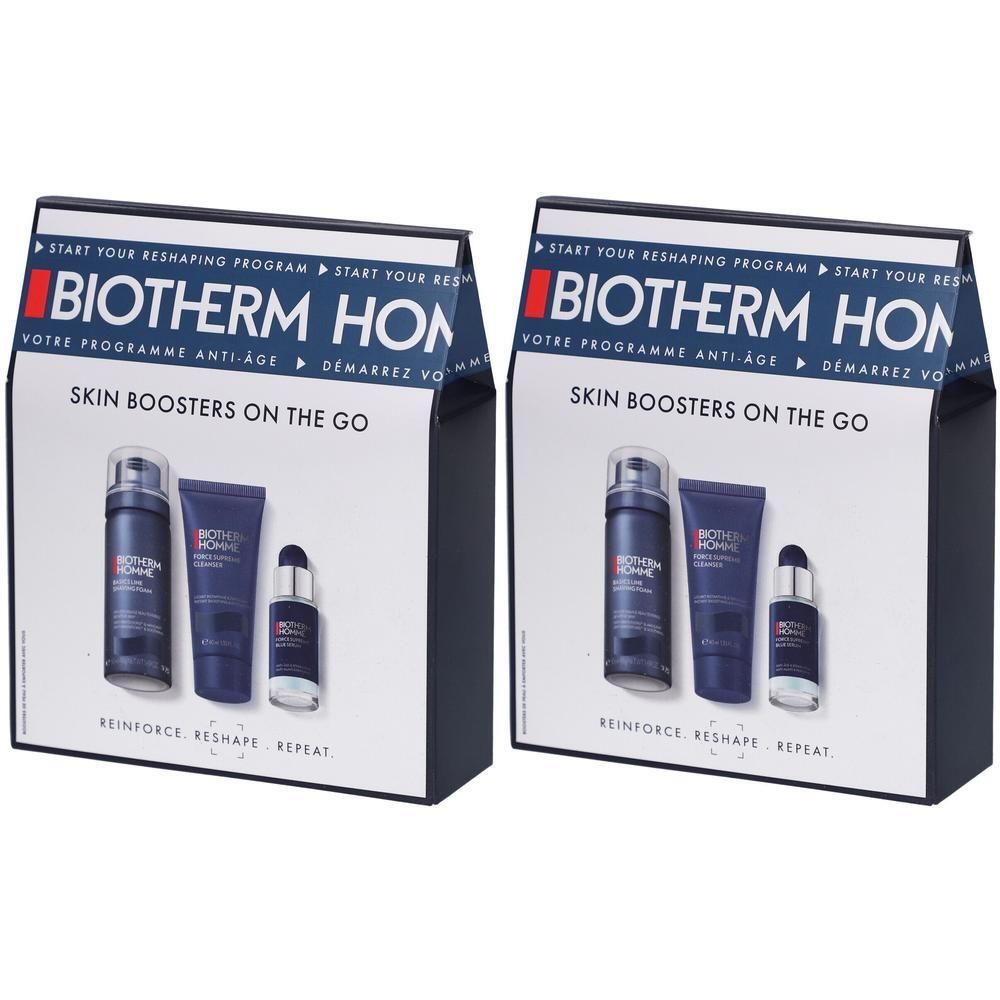 Zwei Geschenksets von Biotherm Homme. Jedes Set enthält drei Hautpflegeprodukte in einer Schachtel mit Markenlogo und Produktnamen.