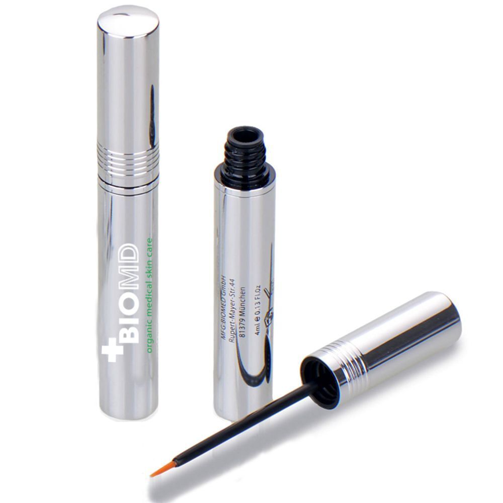 Silberne Serumflasche mit Applikator. Offene Flasche mit Pinsel. BIOMD-Logo und Produktinformationen sind sichtbar.