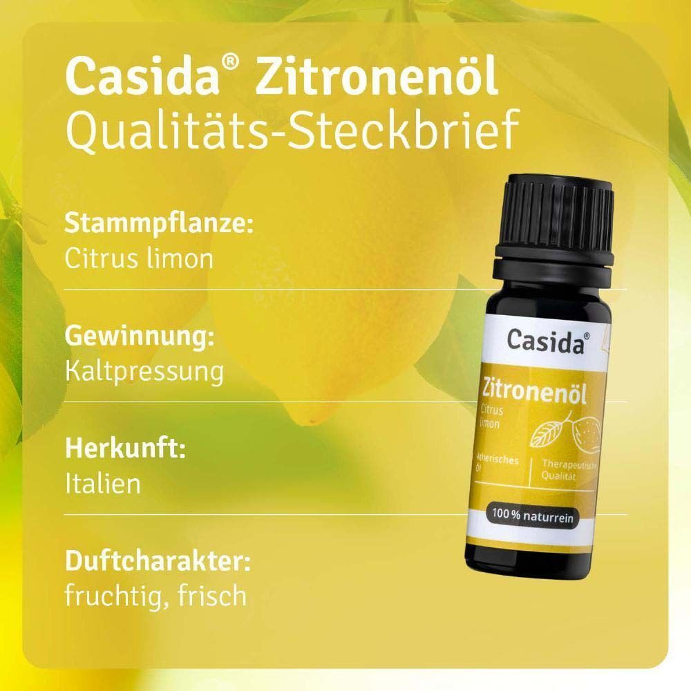 Eine Flasche Casida Zitronenöl. Gelber Hintergrund mit Informationen: Citrus limon, Kaltpressung, Herkunft Italien. 100% naturrein.