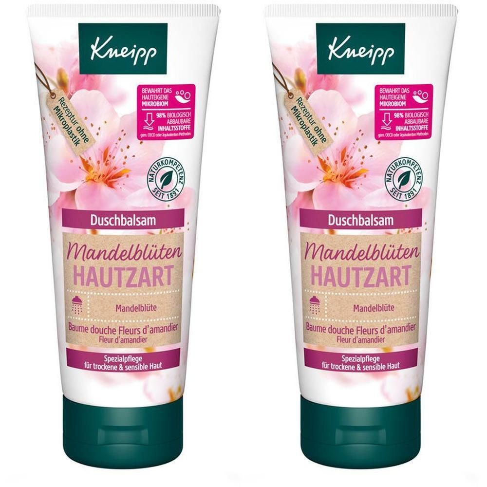 Zwei Tuben Duschbalsam. Weiß, mit rosa und braunen Akzenten. Aufschrift: Mandelblüten, hautzart. Mit Blütenabbildung.