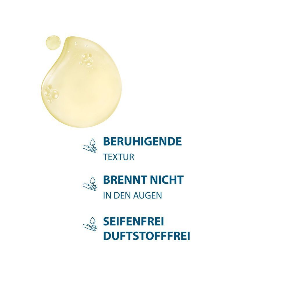 Tropfen gelber Flüssigkeit. Text: Beruhigende Textur, brennt nicht in den Augen, seifenfrei, duftstofffrei.