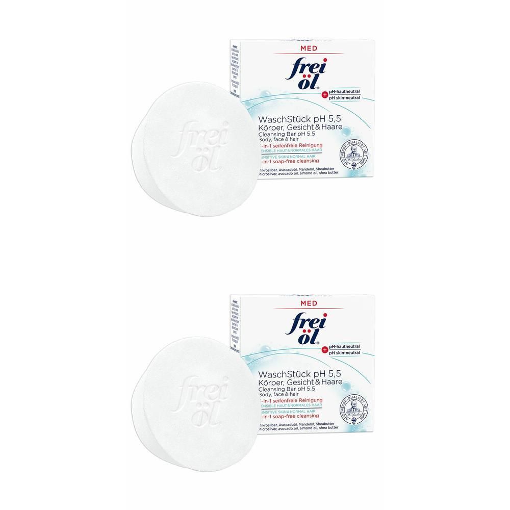 Zwei weiße, runde Waschstücke mit geprägtem frei öl Logo und zwei Produktverpackungen.