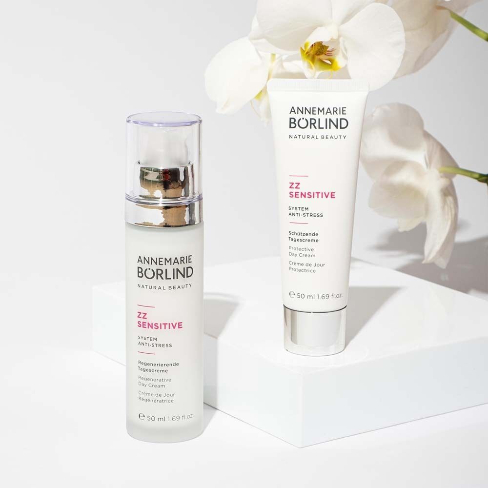 ANNEMARIE BÖRLIND ZZ SENSITIVE Tagescreme (50ml) und eine Tube mit Orchideen.