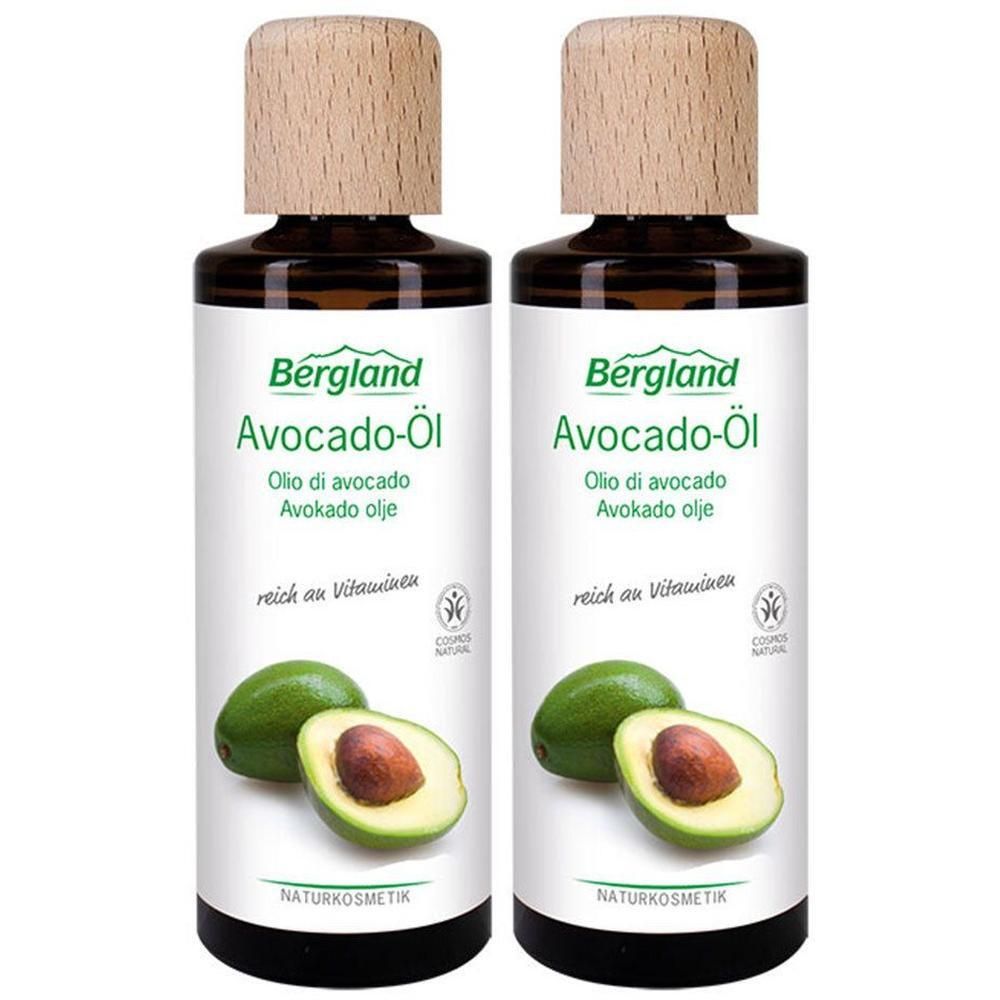 Zwei Flaschen mit Holzdeckel. Aufschrift: Bergland Avocado-Öl. Abbildung von Avocadofrüchten. Naturkosmetik.