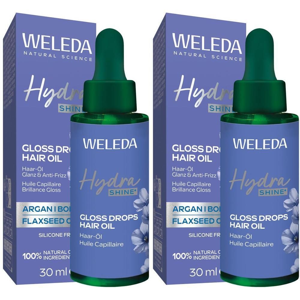 Zwei Flaschen Weleda Hydra Shine Gloss Drops Haar-Öl. Blaue Etiketten, grüne Deckel. Verpackung mit Produktnamen und Inhaltsstoffen.