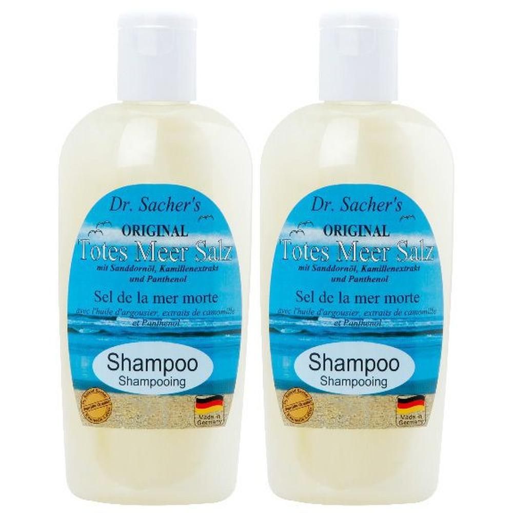 Zwei Flaschen Shampoo mit weißem Deckel. Aufschrift: Dr. Sacher's Original Totes Meer Salz. Mit Meerblick-Etikett und deutscher Flagge.