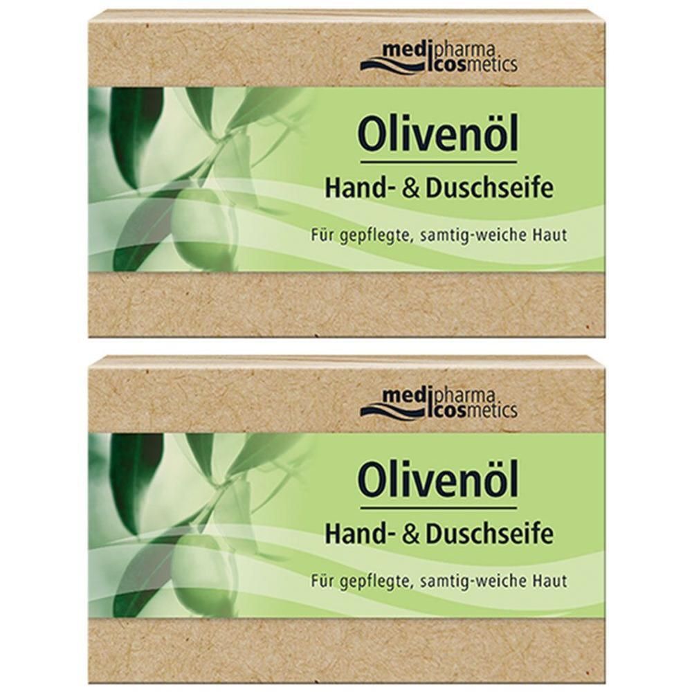 Zwei rechteckige Seifenverpackungen. Aufschrift: Olivenöl Hand- & Duschseife. Marke: medipharma cosmetics. Grün-weiße Etiketten mit Olivenzweig-Motiv.