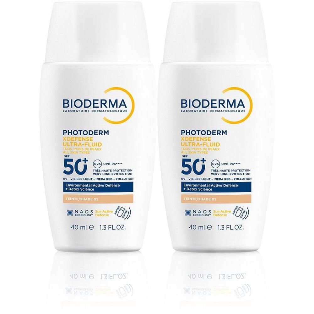 Zwei Flaschen mit weißem Deckel. Aufschrift: BIODERMA, Photoderm Xdefense Ultra-Fluid, LSF 50+. 40 ml.