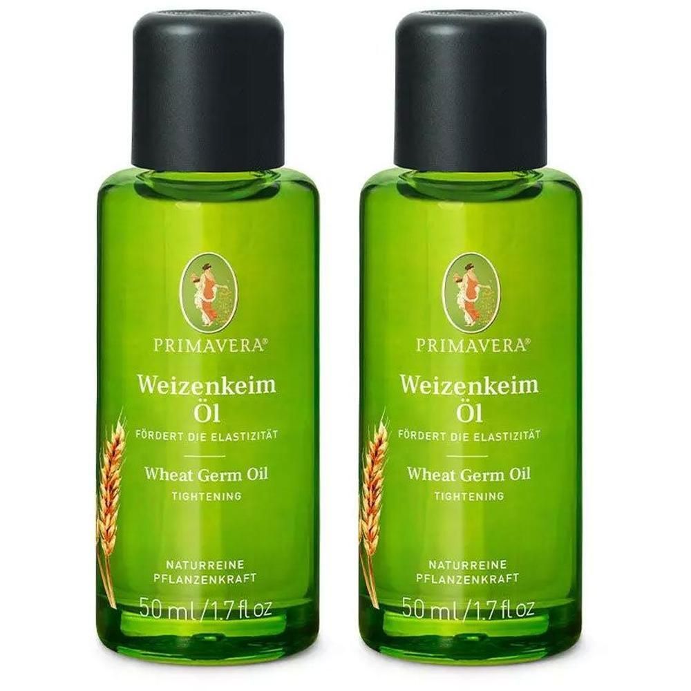 Zwei grüne Flaschen mit schwarzem Deckel. Aufschrift: Primavera Weizenkeim Öl. Enthält 50 ml. Mit Weizenähren-Illustration.